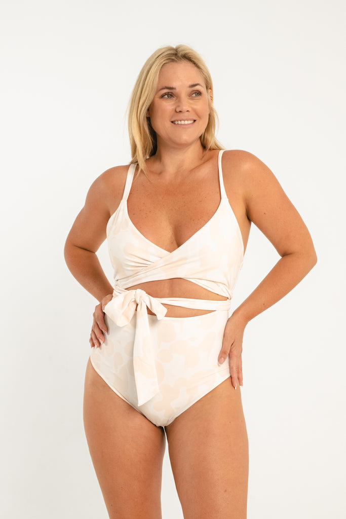 Tan and white patterned one piece women's swimsuit with tie in the front
