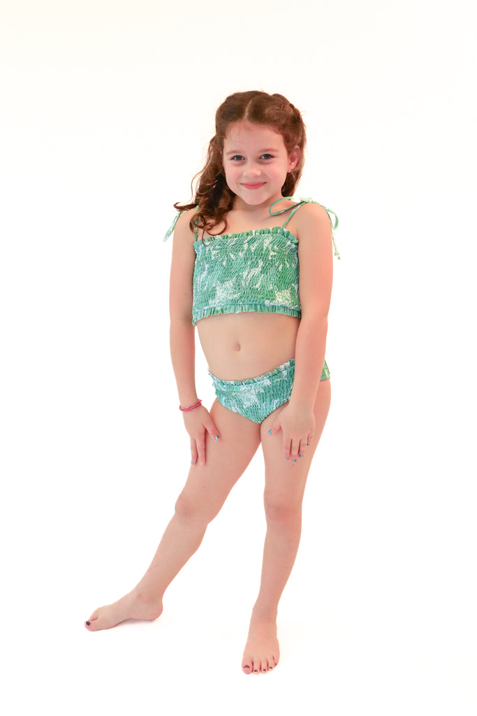 green tropical girls bikini set with smocked detailing and thin adjustable straps and slightly high waisted bottoms